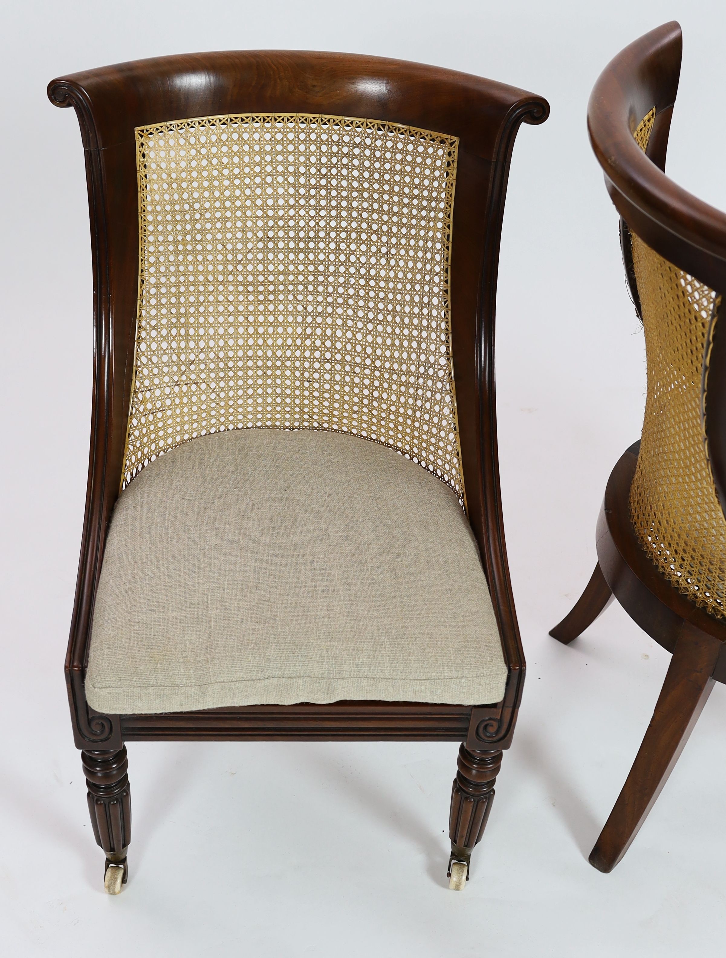 A pair of late Regency mahogany bergere side chairs